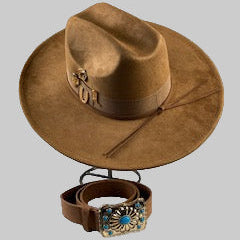 Brown cowboy hat with a belt and decorative buckle on a gray background