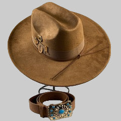 Brown cowboy hat with a matching belt on a gray background