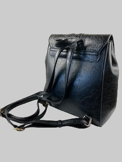Black leather bag on a light gray background