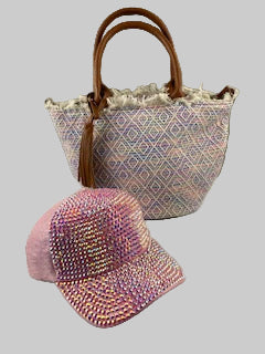 Decorative basket with a textured pattern and a pink beaded item on a light gray background